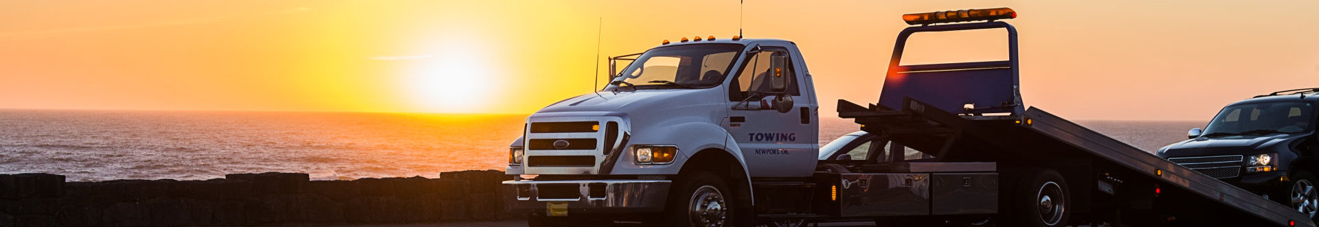 photo of a trailer truck on a sunset background